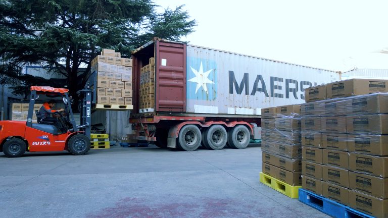 disposable tableware loading into a shipping container at the Runxiang factory