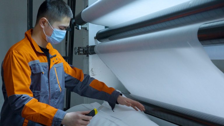 Operator checking the printed film during production